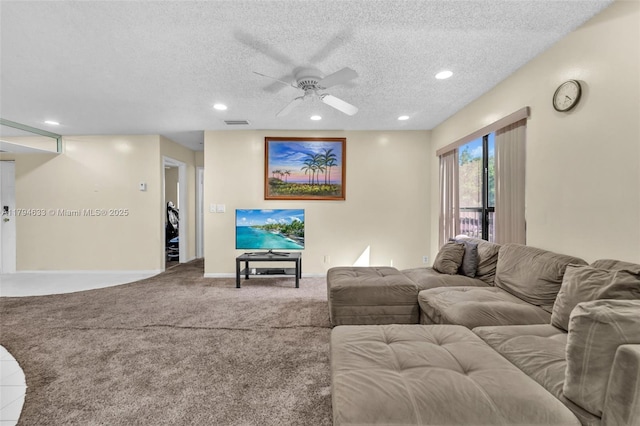 carpeted living room featuring ceiling fan, recessed lighting, and a textured ceiling