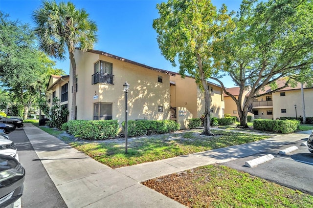 3699 Cocoplum Cir Unit 3538, Coconut Creek, FL 33063 - view of property exterior with stucco siding
