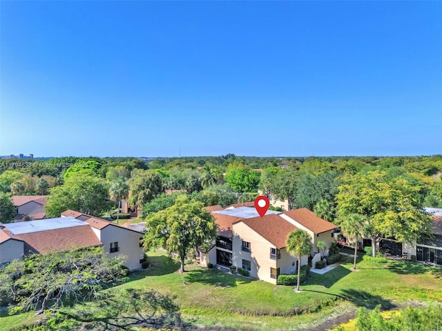 aerial view featuring a wooded view