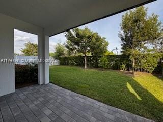 view of patio featuring fence
