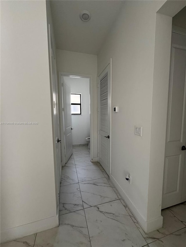 4409 SW 173rd Ave, Miramar, FL 33029 - hall featuring light marble finish flooring and baseboards