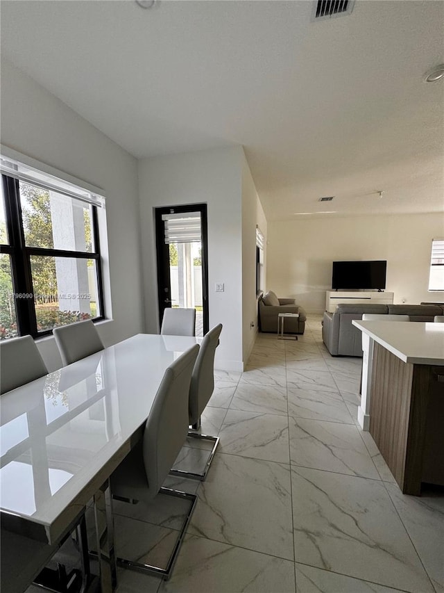 4409 SW 173rd Ave, Miramar, FL 33029 - dining space featuring light marble finish floors and baseboards