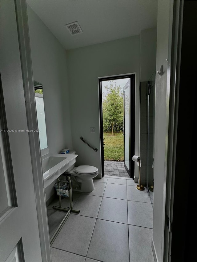 4409 SW 173rd Ave, Miramar, FL 33029 - bathroom featuring tile patterned flooring, toilet, and a shower