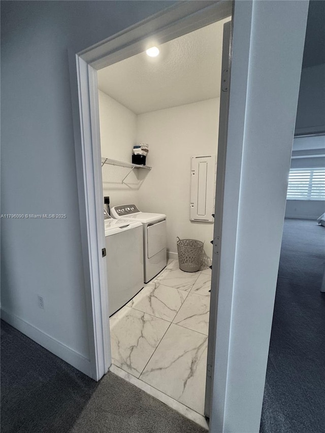 4409 SW 173rd Ave, Miramar, FL 33029 - laundry area featuring separate washer and dryer, marble look tiles, electric panel, and baseboards