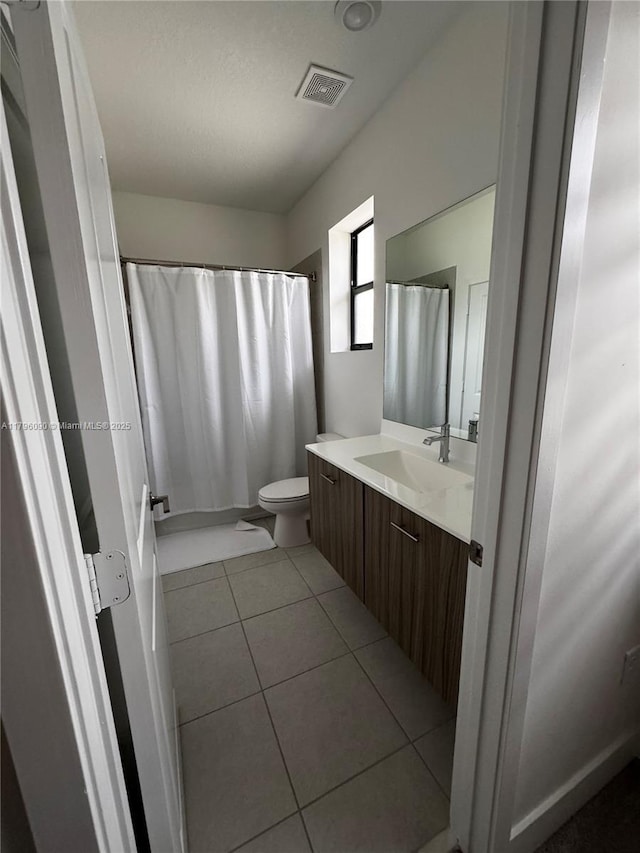4409 SW 173rd Ave, Miramar, FL 33029 - bathroom featuring tile patterned flooring, vanity, toilet, and a shower with shower curtain