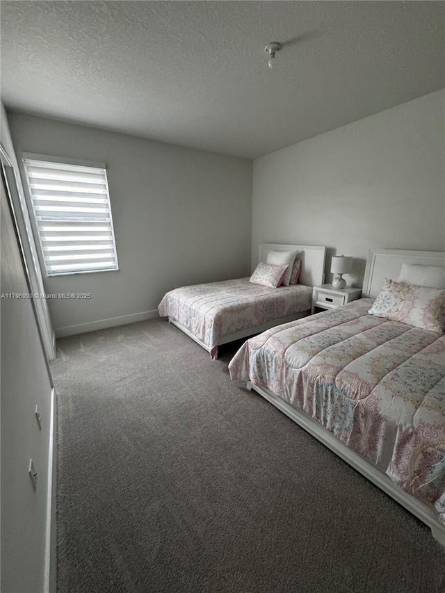 4409 SW 173rd Ave, Miramar, FL 33029 - carpeted bedroom featuring a textured ceiling and baseboards