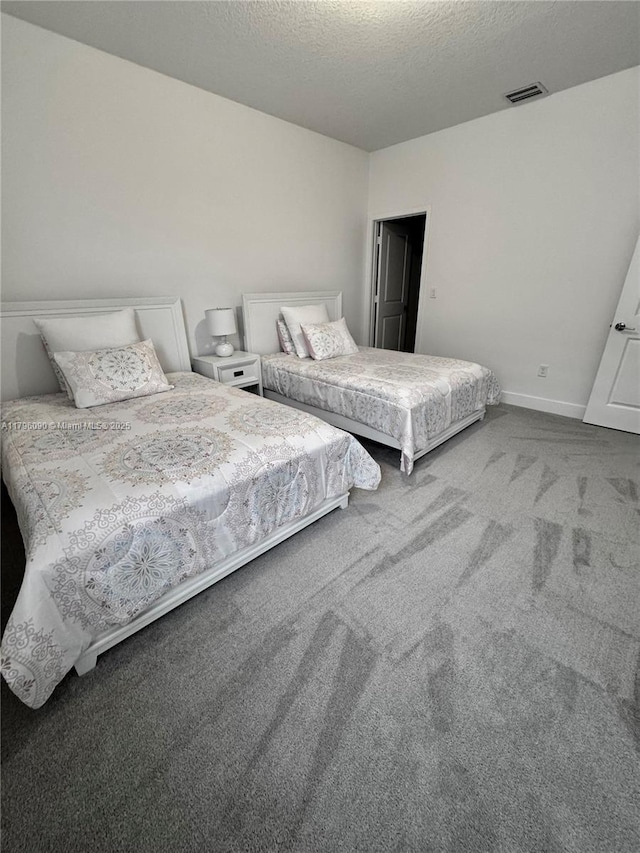 4409 SW 173rd Ave, Miramar, FL 33029 - carpeted bedroom featuring a textured ceiling and baseboards