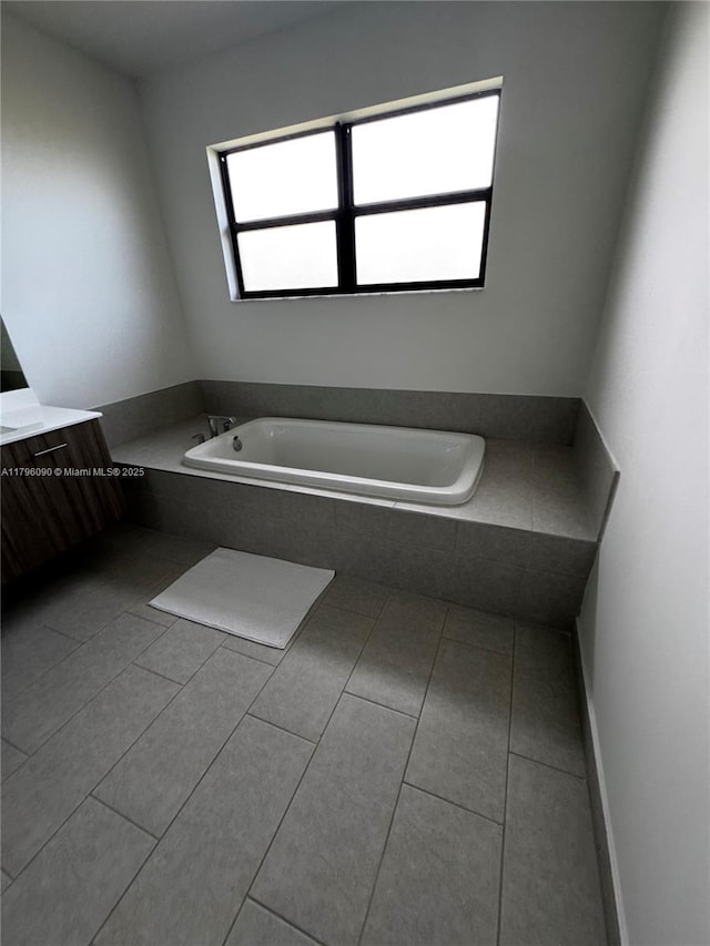 4409 SW 173rd Ave, Miramar, FL 33029 - bathroom with a garden tub, tile patterned flooring, and vanity
