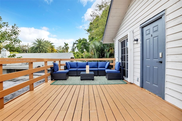 wooden terrace with outdoor lounge area
