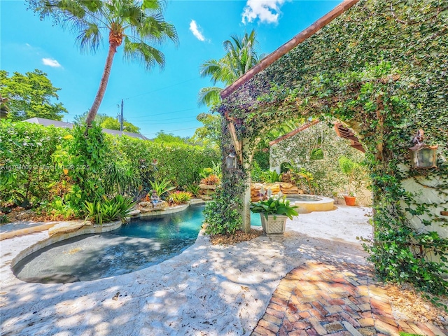 1229 Sorolla Ave, Coral Gables, FL 33134 - view of pool featuring a patio area and an outdoor hot tub
