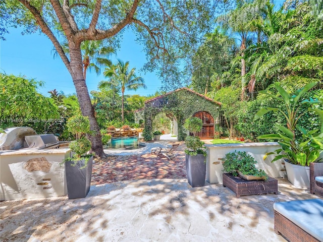 1229 Sorolla Ave, Coral Gables, FL 33134 - view of patio / terrace with exterior kitchen