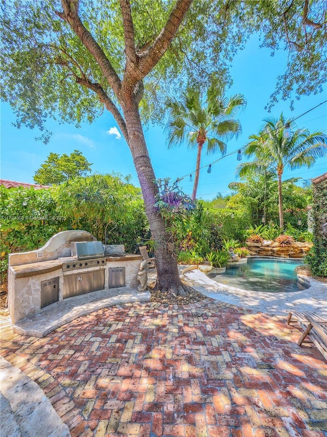1229 Sorolla Ave, Coral Gables, FL 33134 - view of patio with an outdoor kitchen and area for grilling