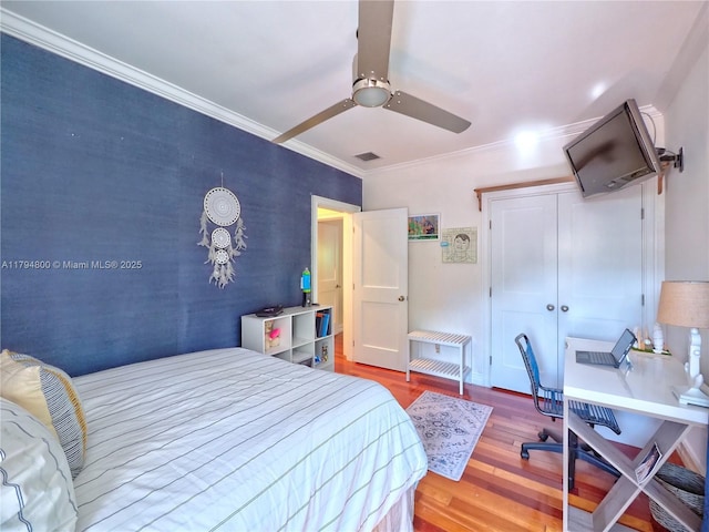 1229 Sorolla Ave, Coral Gables, FL 33134 - bedroom featuring wood finished floors, a desk, crown molding, ceiling fan, and a closet