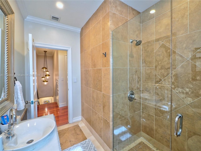 1229 Sorolla Ave, Coral Gables, FL 33134 - bathroom with a sink, a shower stall, ornamental molding, and tile patterned flooring