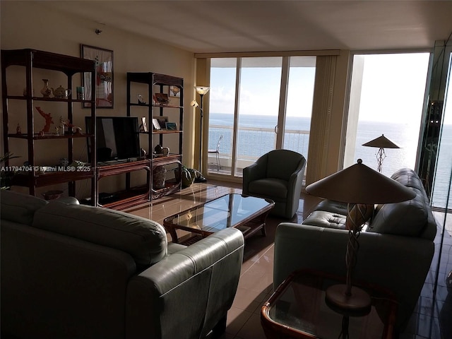 tiled living room with a wall of windows