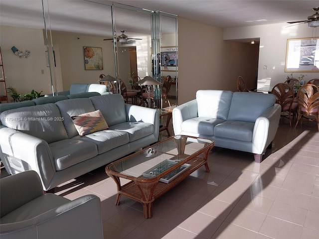 tiled living room with ceiling fan