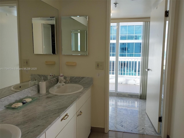 bathroom with vanity and baseboards