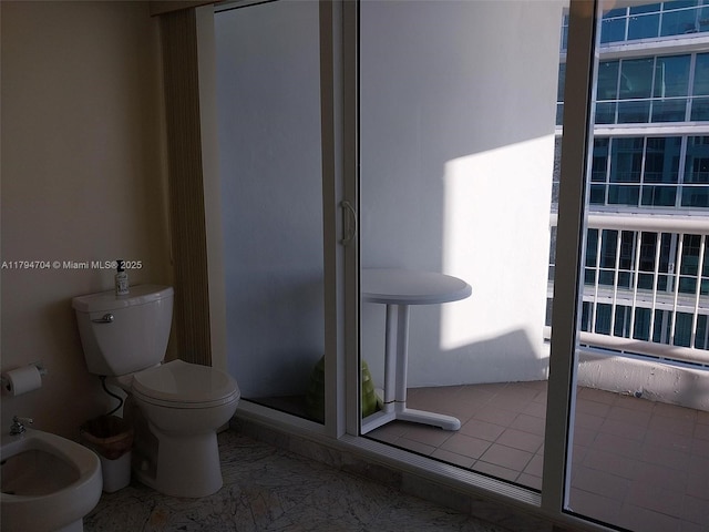 full bathroom with a bidet, a shower stall, and toilet