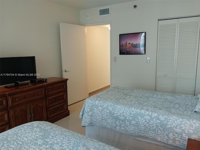 bedroom featuring a closet and visible vents