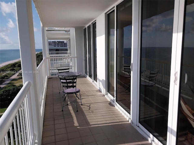 balcony featuring a water view