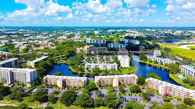 bird's eye view featuring a view of city and a water view