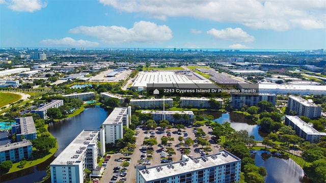 drone / aerial view with a view of city and a water view