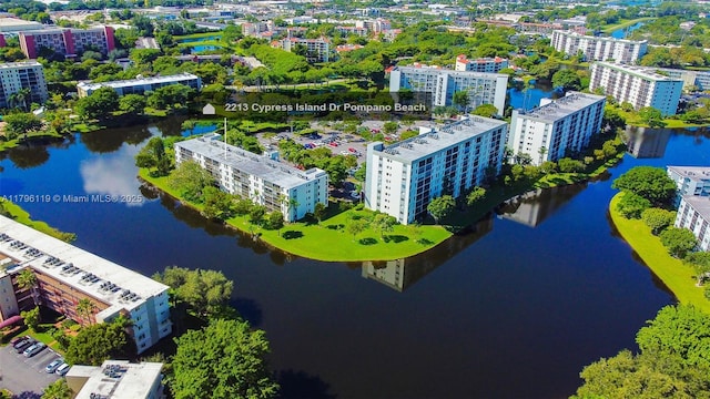 bird's eye view featuring a water view and a city view