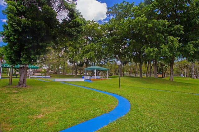 view of property's community with a gazebo and a yard