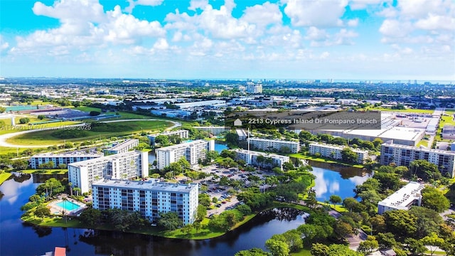 drone / aerial view featuring a water view and a city view