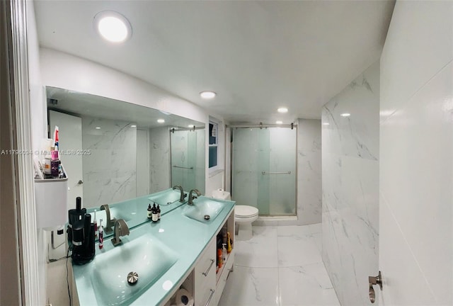 bathroom featuring a sink, marble finish floor, a marble finish shower, and toilet