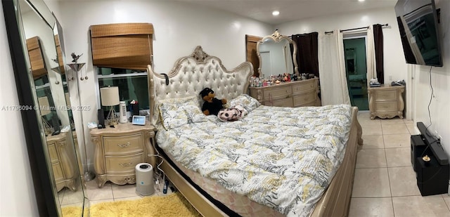 bedroom with light tile patterned flooring and recessed lighting