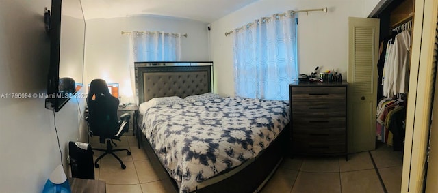 bedroom with tile patterned floors