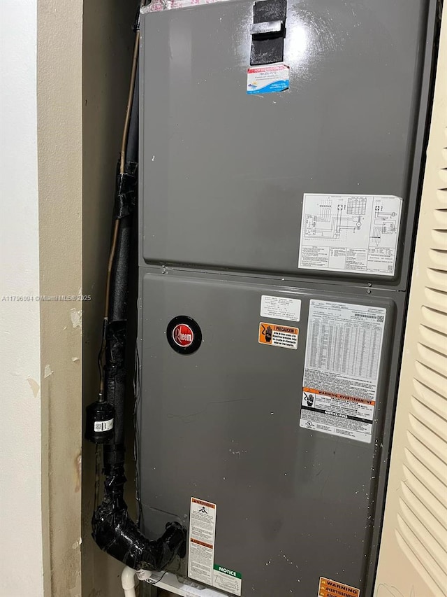utility room featuring heating unit