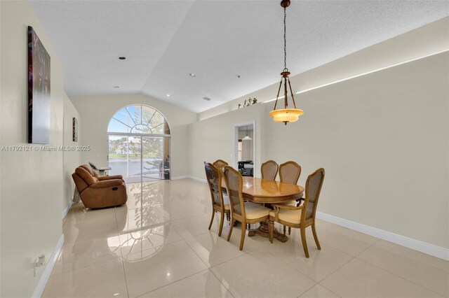 18271 SW 27th St, Miramar, FL 33029 - dining area featuring vaulted ceiling, baseboards, and tile patterned floors
