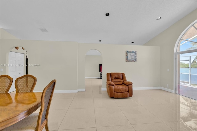 18271 SW 27th St, Miramar, FL 33029 - living area with arched walkways, light tile patterned flooring, and baseboards