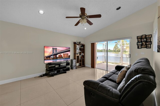 18271 SW 27th St, Miramar, FL 33029 - tiled living room with baseboards, vaulted ceiling, ceiling fan, a textured ceiling, and recessed lighting