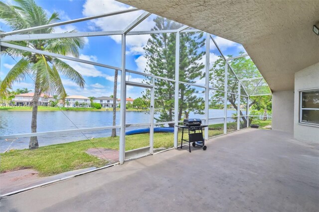 18271 SW 27th St, Miramar, FL 33029 - view of patio / terrace featuring a lanai, a water view, and area for grilling