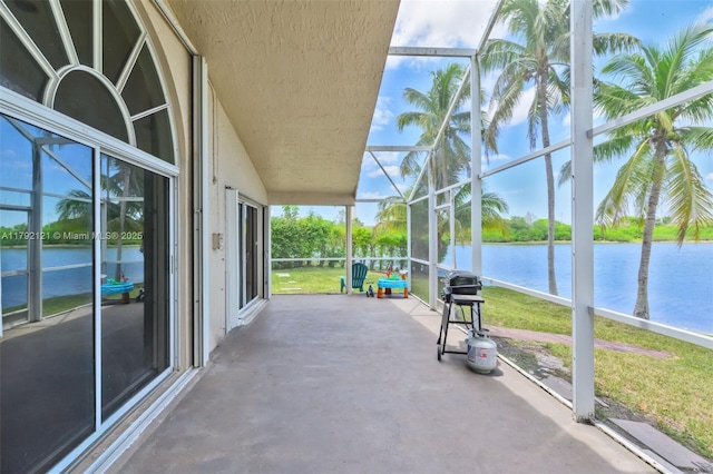 18271 SW 27th St, Miramar, FL 33029 - view of patio with a water view and glass enclosure
