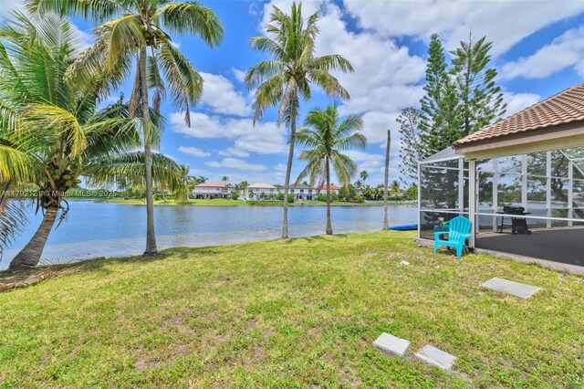 18271 SW 27th St, Miramar, FL 33029 - view of green lawn featuring a water view and glass enclosure