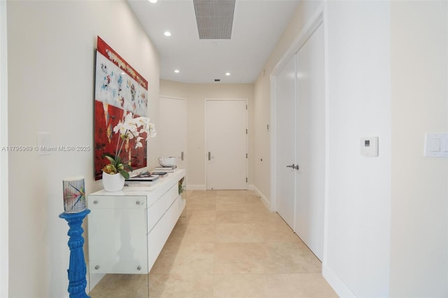 corridor with light tile patterned floors, recessed lighting, and visible vents