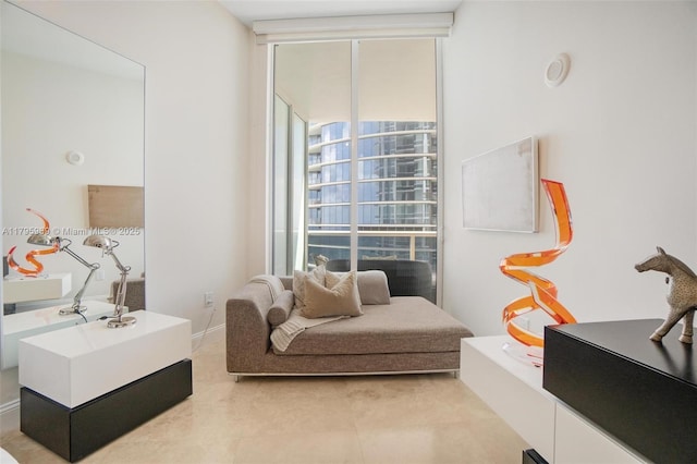 sitting room with a healthy amount of sunlight and a wall of windows