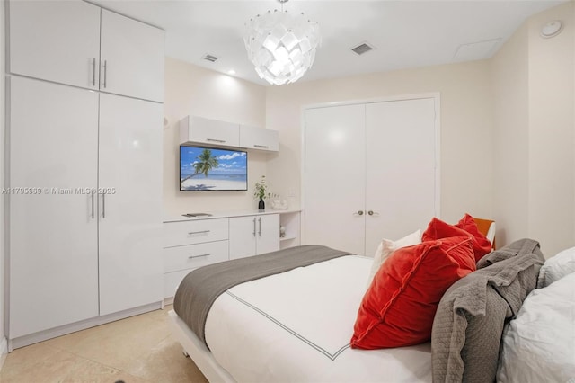 bedroom with visible vents and a closet