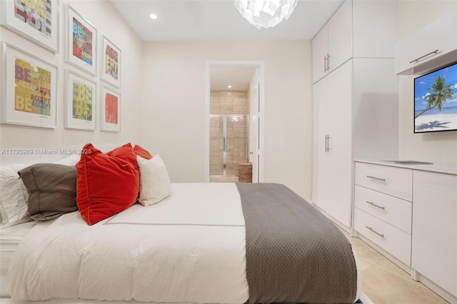 bedroom featuring ensuite bathroom, recessed lighting, and light tile patterned flooring