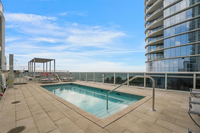 community pool featuring a patio area