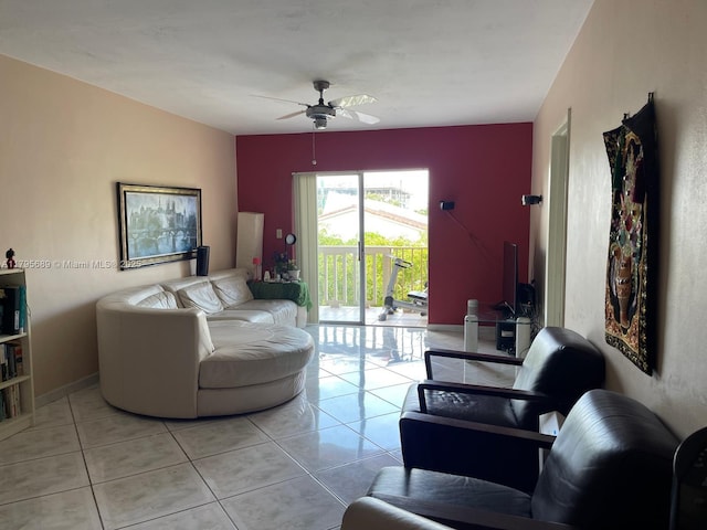 living area with ceiling fan and light tile patterned flooring