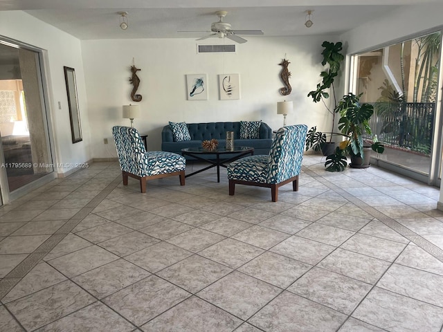 living room with visible vents, ceiling fan, and light tile patterned flooring