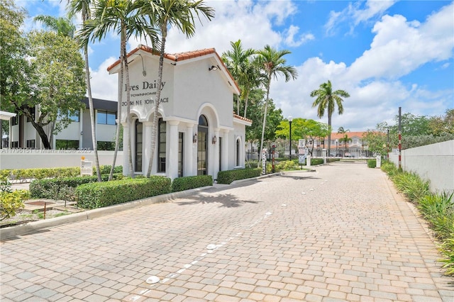 view of building exterior with fence