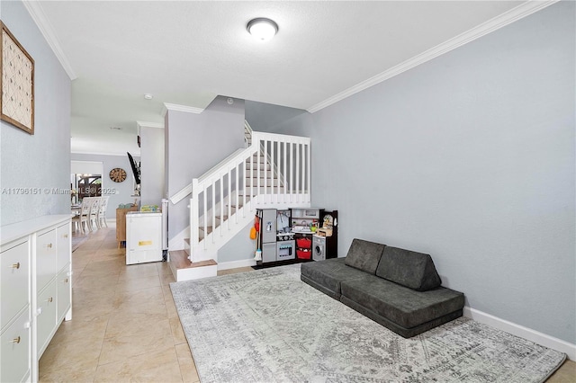 sitting room with crown molding, light tile patterned flooring, baseboards, and stairway