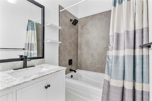 bathroom featuring shower / bath combo with shower curtain and vanity