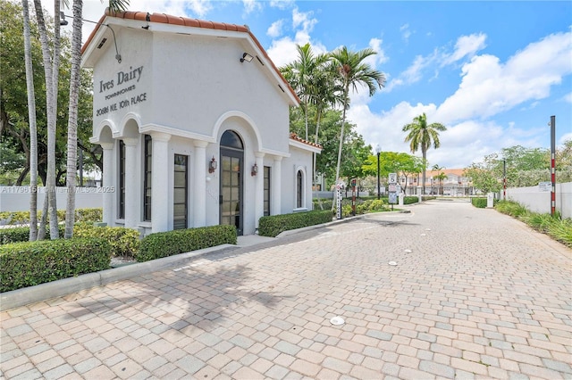 exterior space with fence and driveway